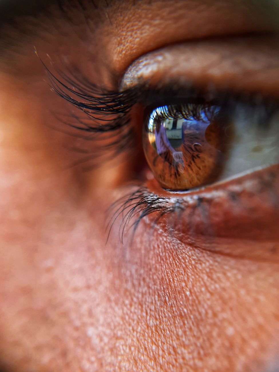 persons eye in close up photography