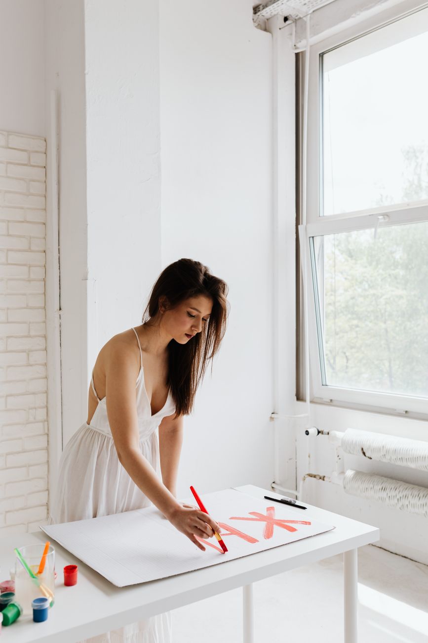 a woman writing on the paper