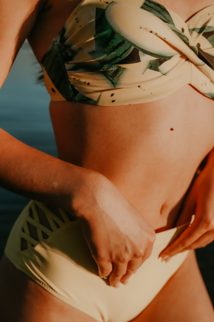 woman in green and white floral bikini