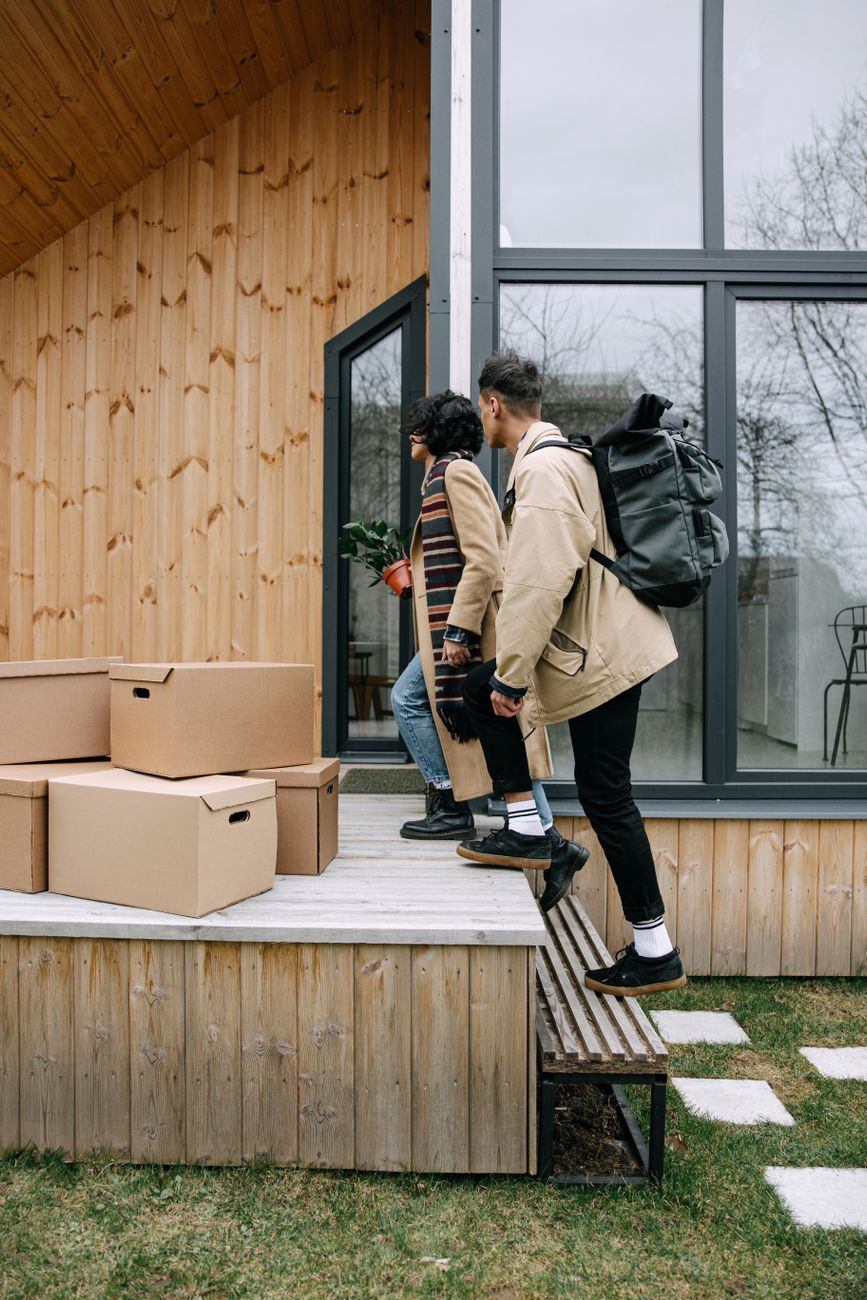 a couple walking into their new home